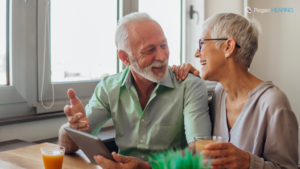 Older couple discussing PIP options with a tablet.