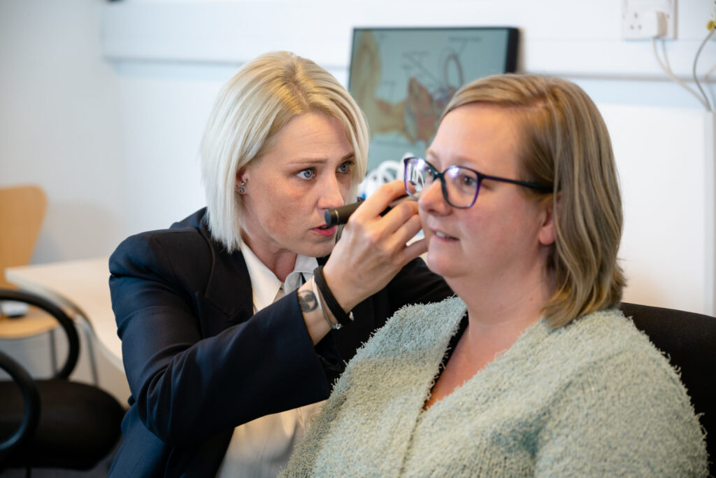 audiologist performing ear wax removal in Croydon